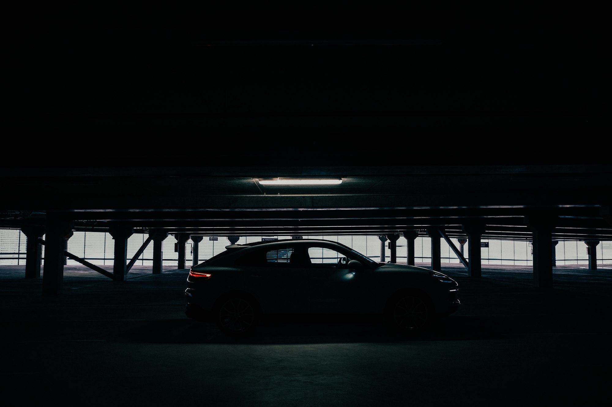 Sports car in parking garage. Cinematic